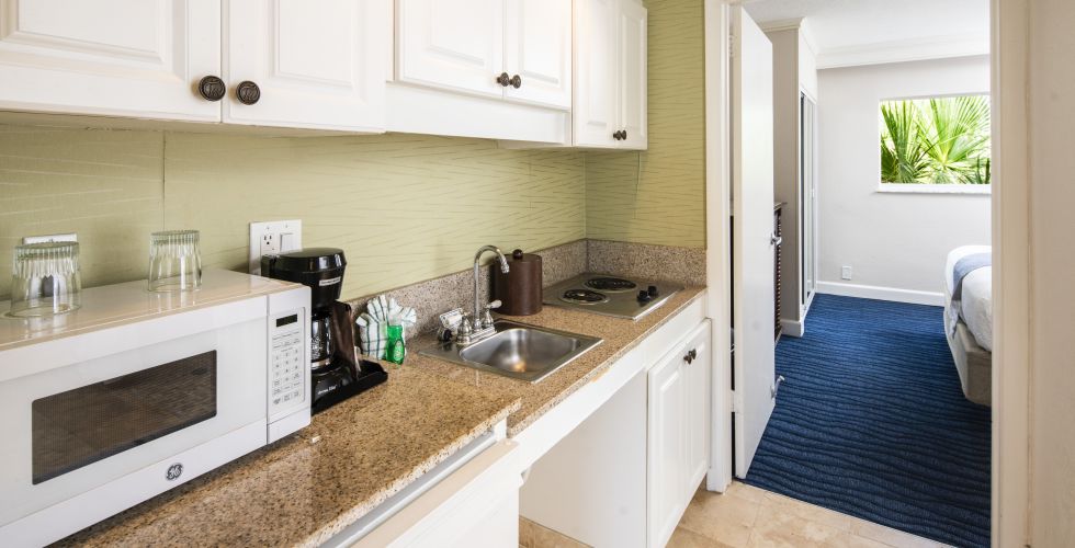 A Kitchen With A Sink And A Window