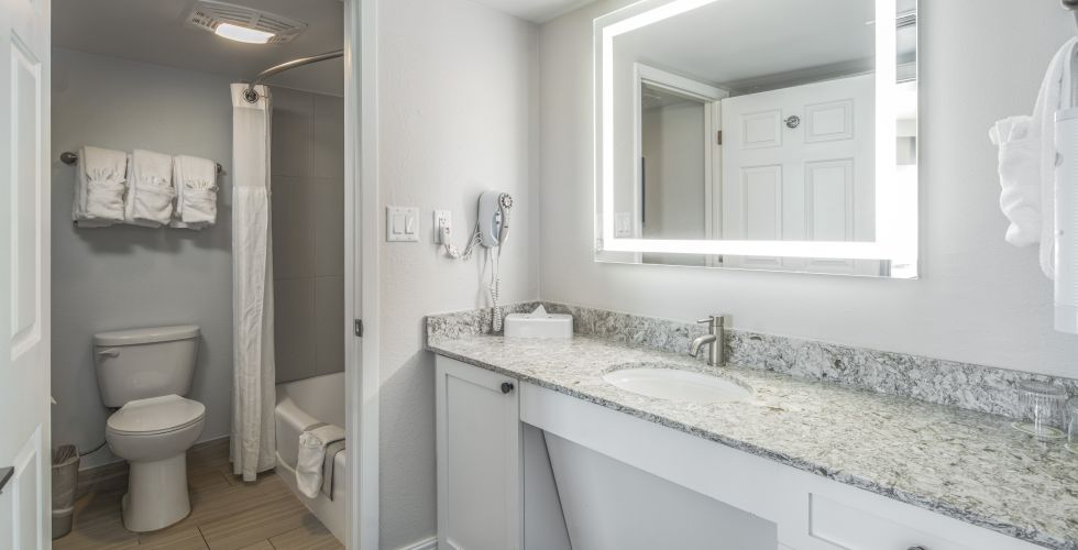 A Bathroom With A Marble Countertop