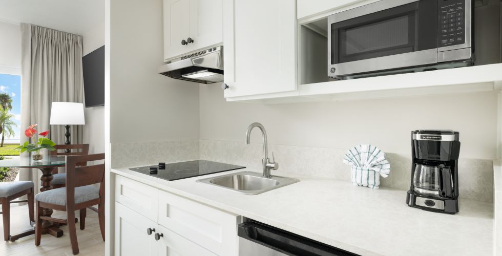 A Kitchen With White Cabinets