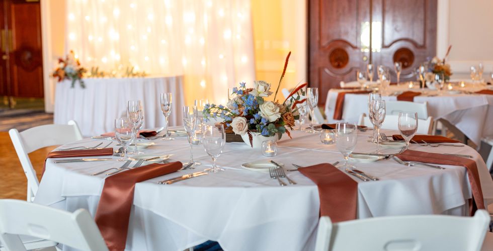 A Dining Room With White Tables And White Cloths