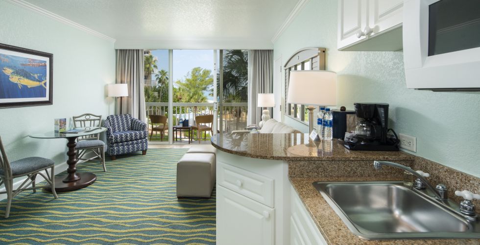 A Room Filled With Furniture And A Large Window