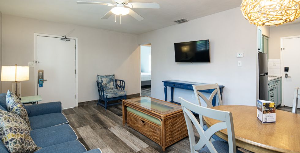A Living Room With A Tv And Couches