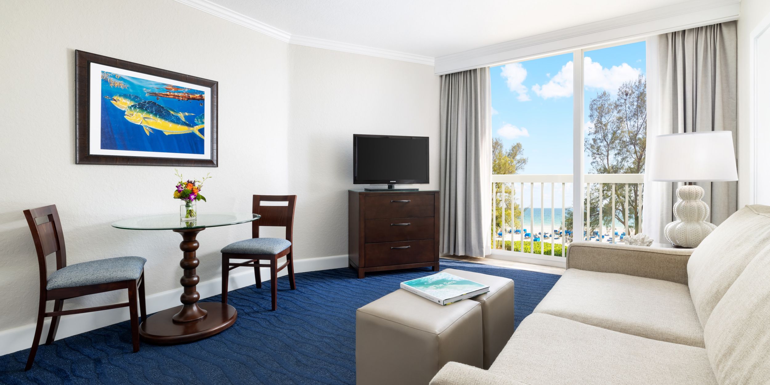 A Living Room With A Blue Rug