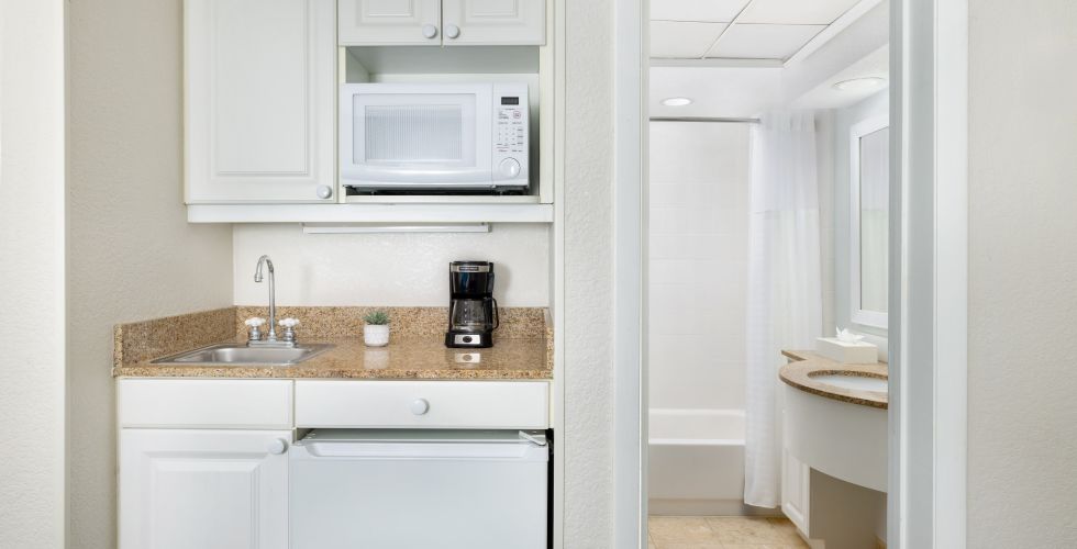 A Kitchen With White Cabinets