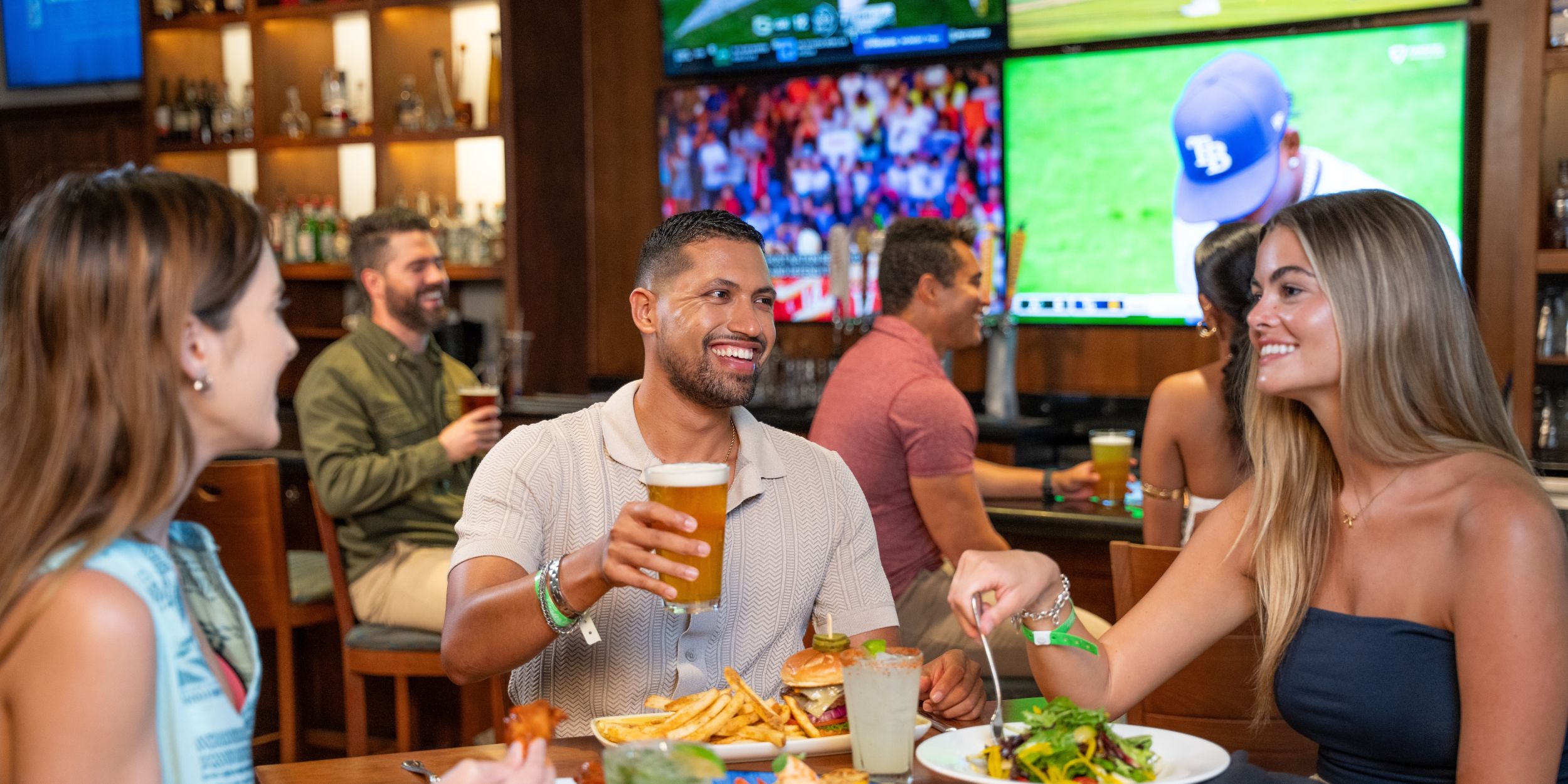 A Group Of People Eating At A Restaurant