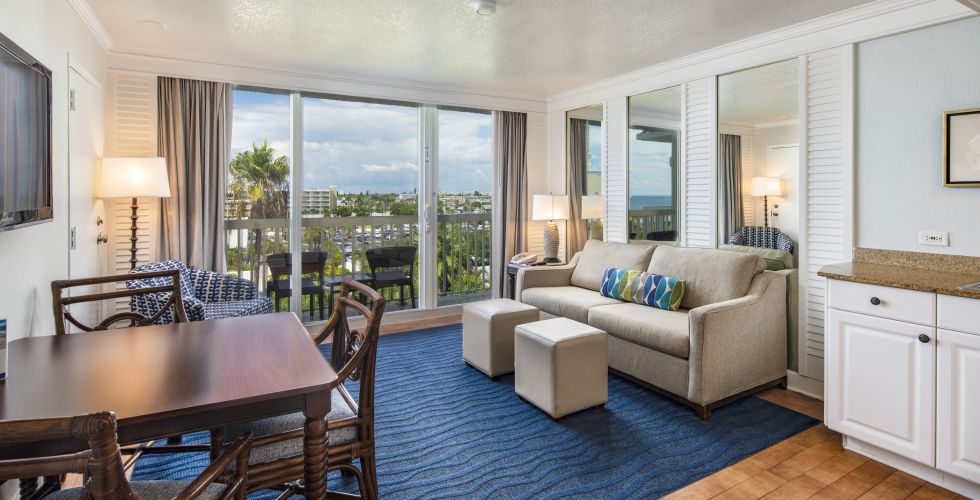 A Living Room With A Pool Table And Chairs