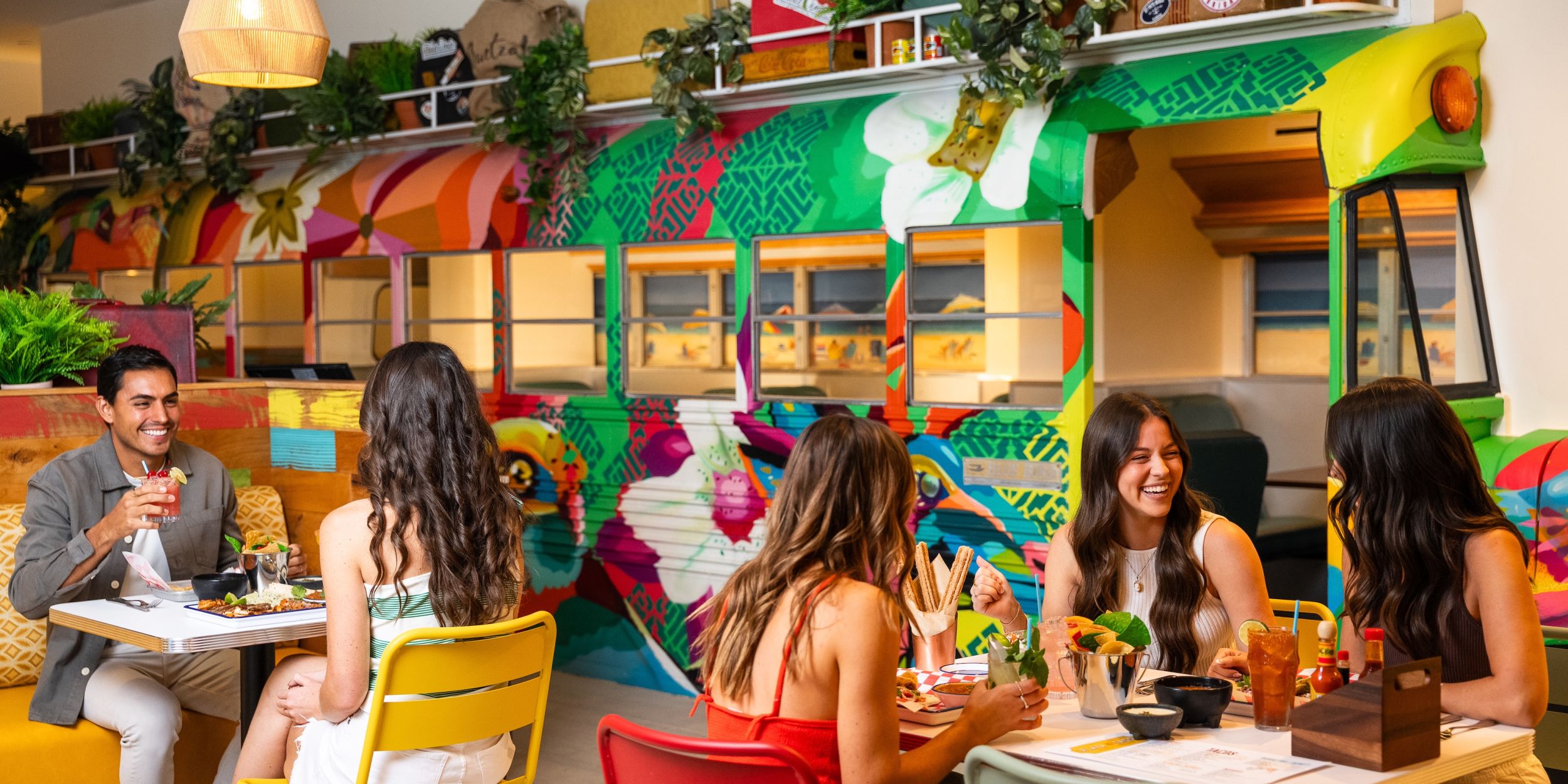 A Group Of People Sitting At A Table