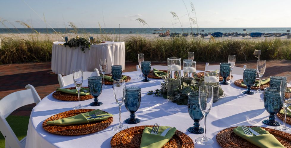 A Table Set With Plates And Glasses