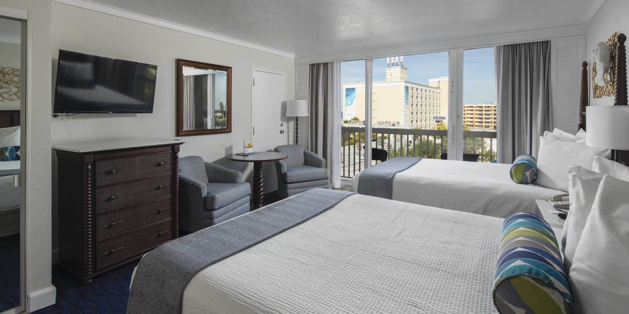A Bedroom With A Large Bed In A Hotel Room