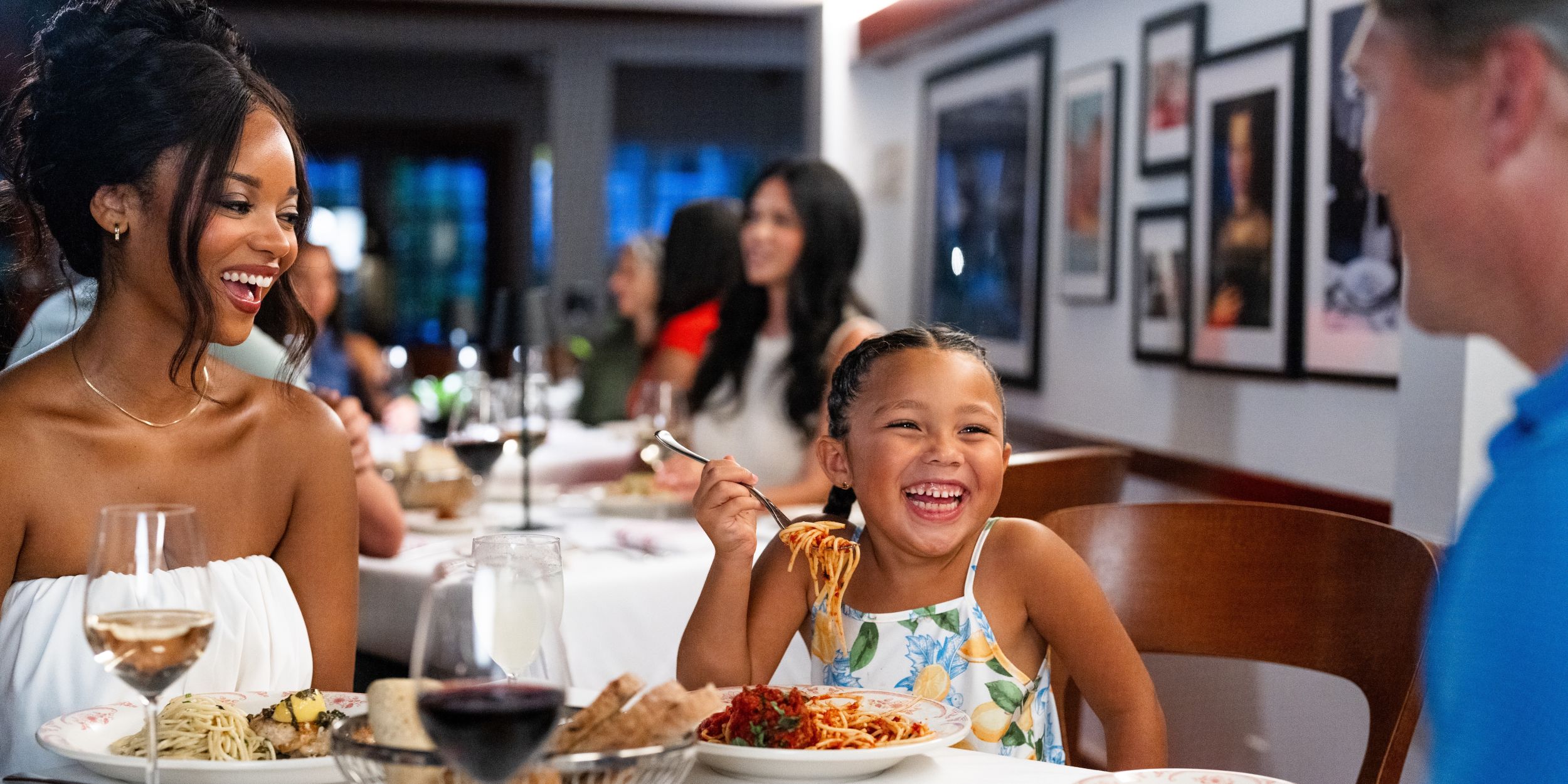A Group Of Women Eating At A Restaurant