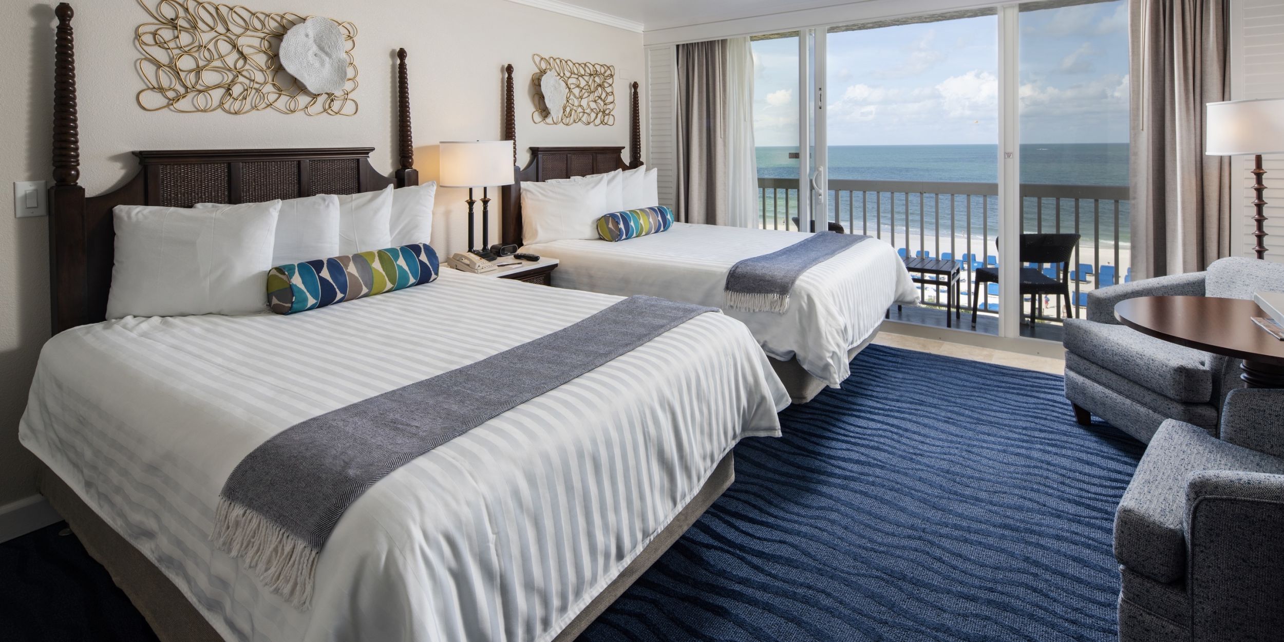 A Bedroom With A Large Bed In A Hotel Room