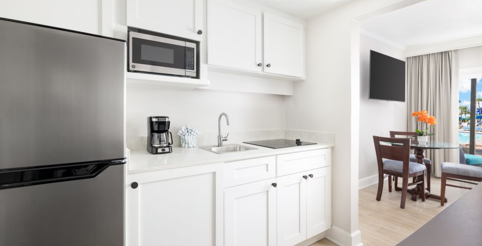 A Kitchen With White Cabinets