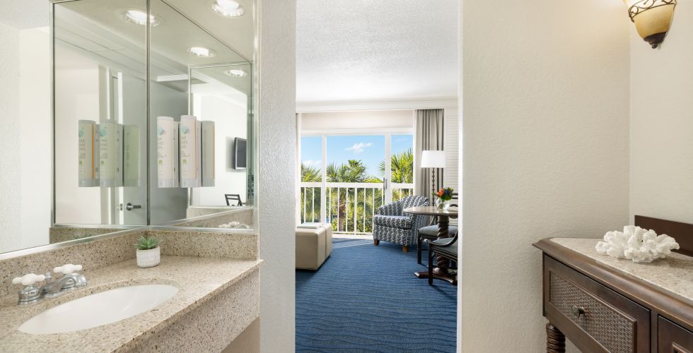 A Bathroom With A Large Mirror