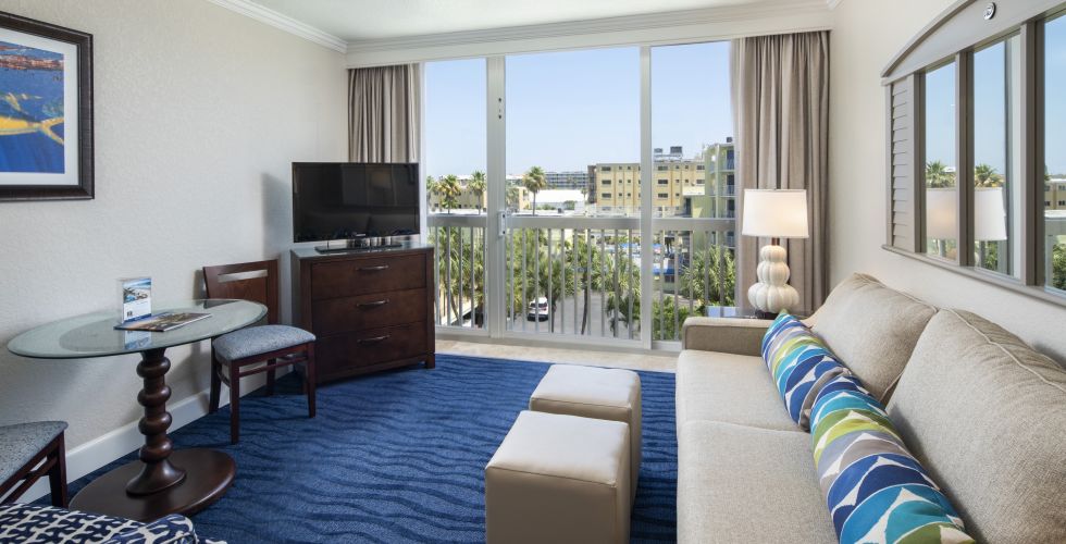 A Living Room Filled With Furniture And A Large Window