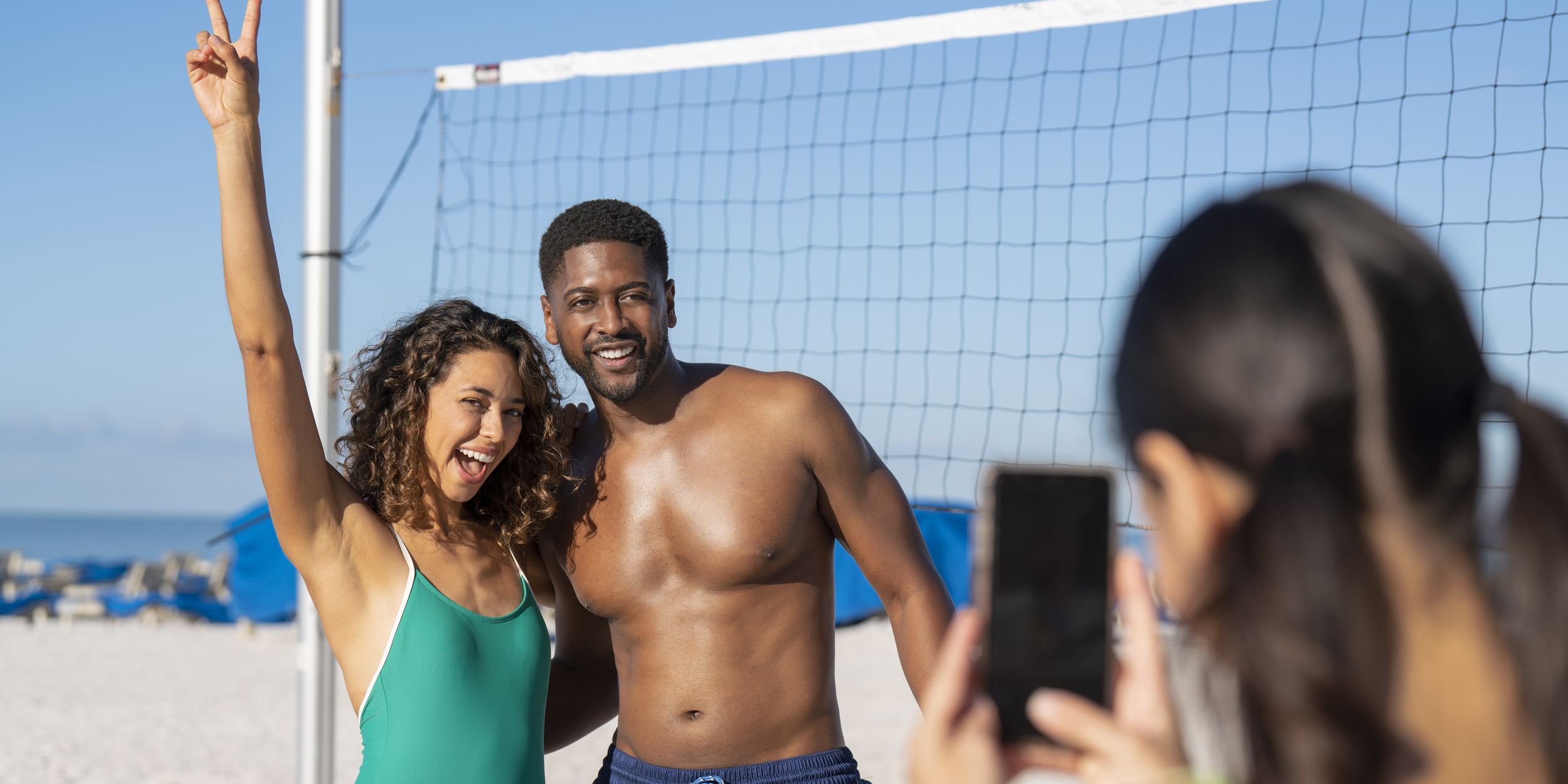 A Man Carrying A Surf Board