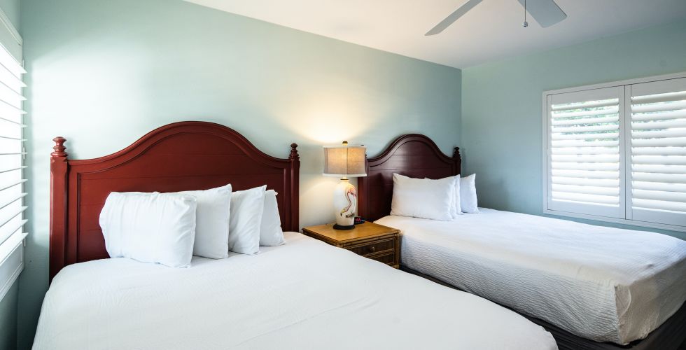 A Couple Of Beds In A Room