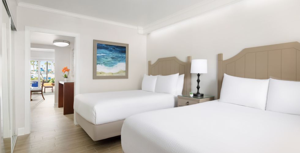 A Bedroom With A Bed And A Lamp