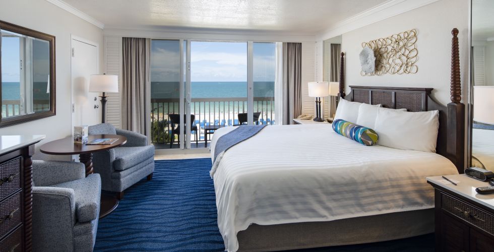 A Bedroom With A Large Bed In A Hotel Room