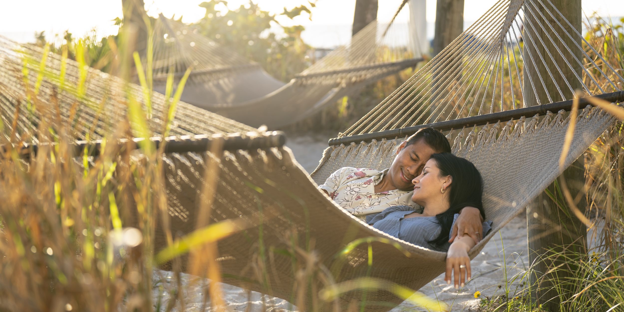 A Man That Is Sitting In The Grass