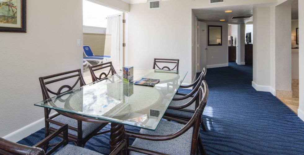 A Bedroom With A Bed And A Chair In A Room