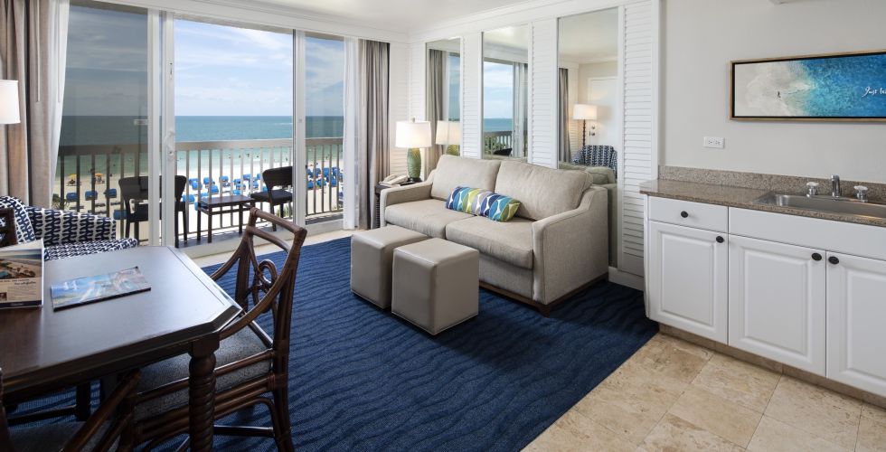 A Room Filled With Furniture And A Large Window