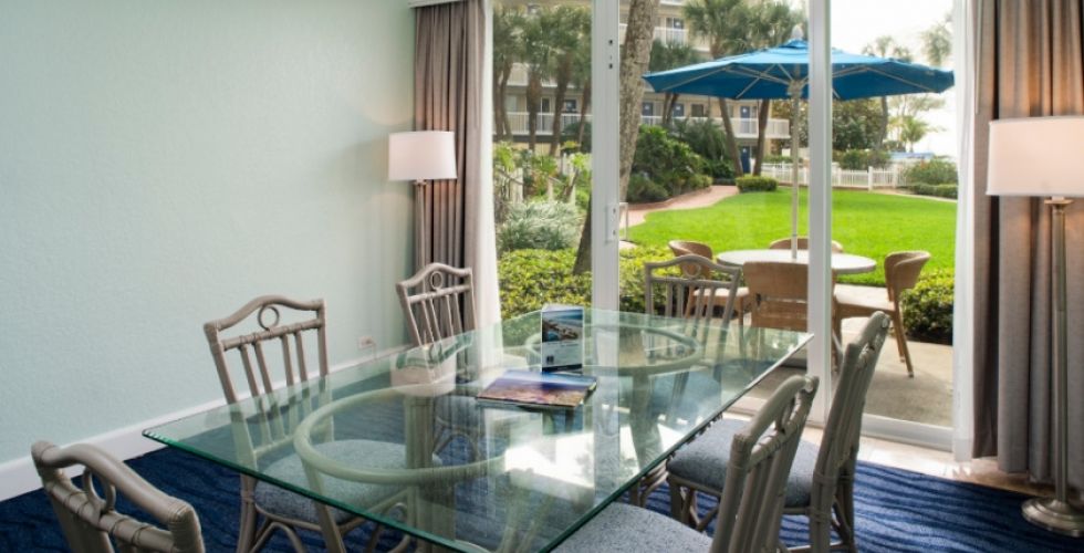 A Living Room Filled With Furniture And A Large Window