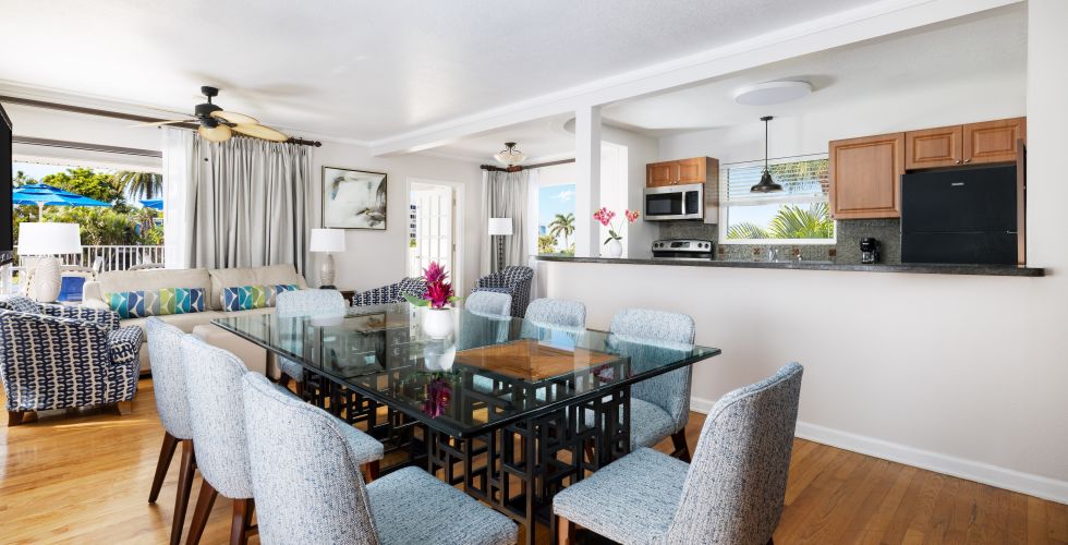 A Large Room With A Table And Chairs