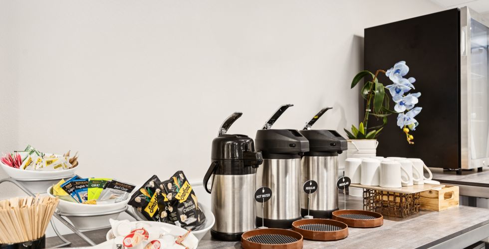 A Kitchen Counter With Food And Drinks