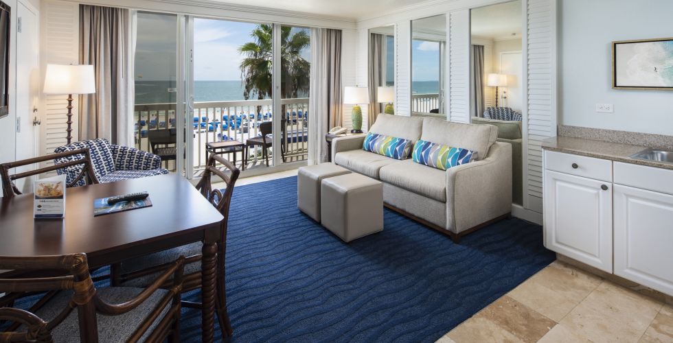 A Living Room Filled With Furniture And A Large Window