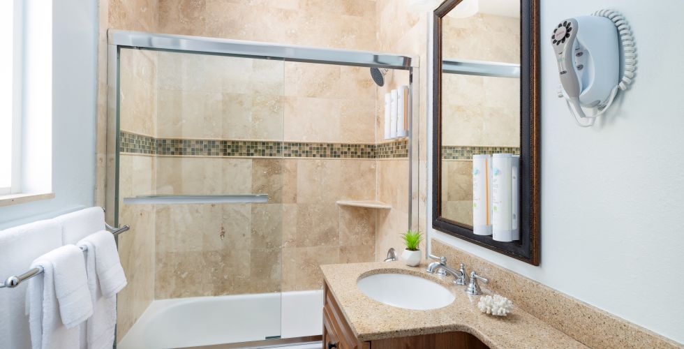 A Bathroom With A Large Mirror