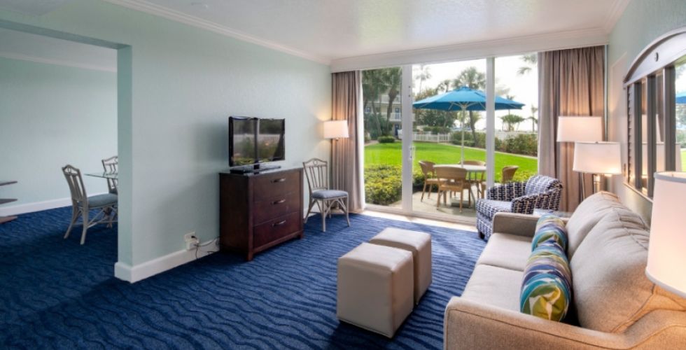 A Living Room Filled With Furniture And A Large Window