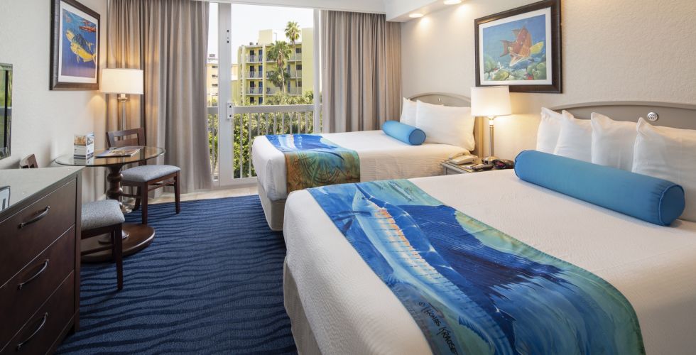 A Bedroom With A Large Bed In A Hotel Room