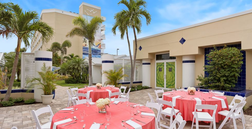 A Group Of Tables And Chairs Outside