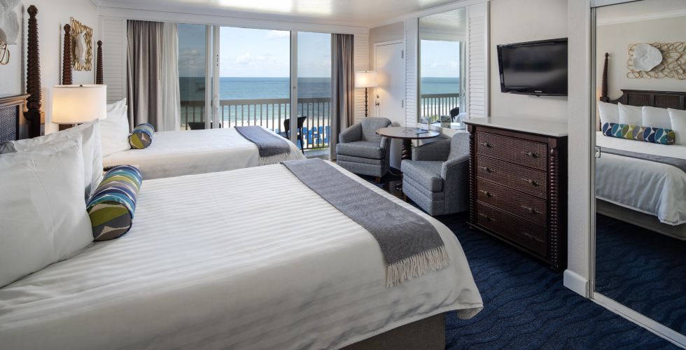 A Bedroom With A Large Bed In A Hotel Room