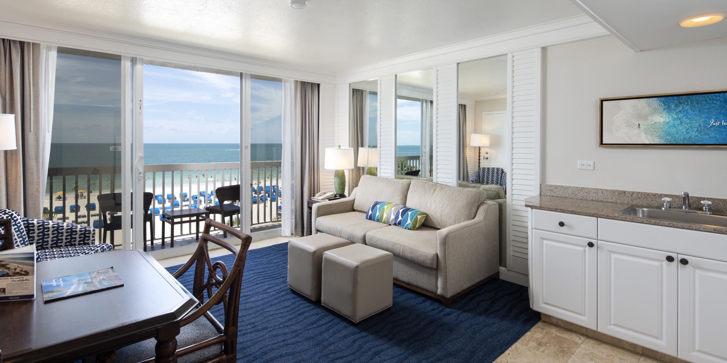 A Room Filled With Furniture And A Large Window