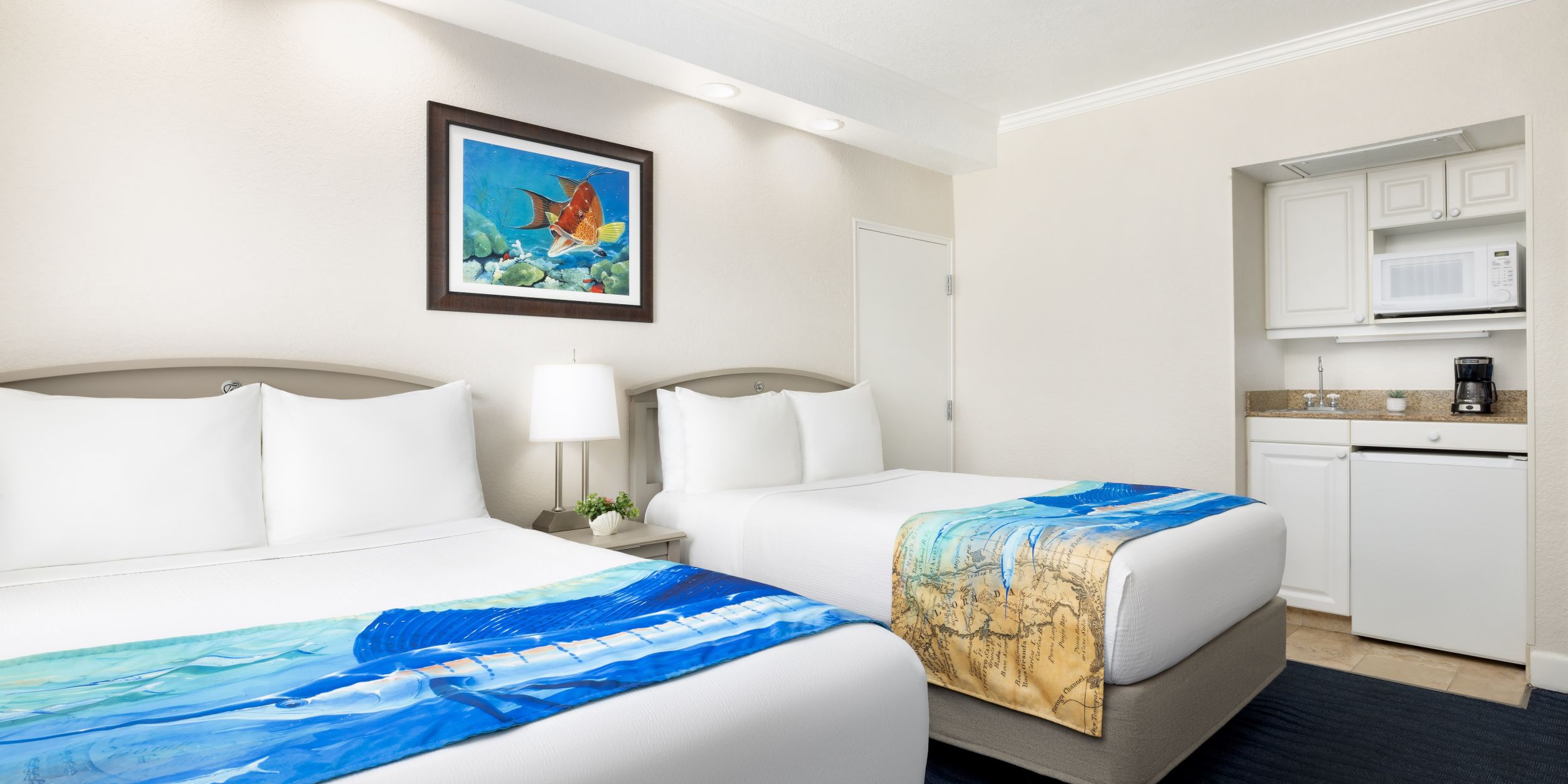 A Couple Of Beds In A Room