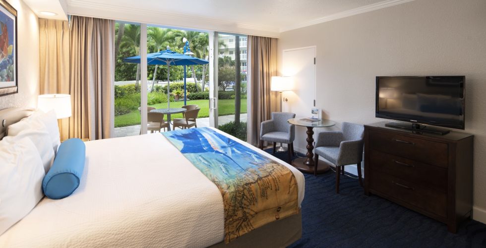 A Bedroom With A Large Bed In A Hotel Room