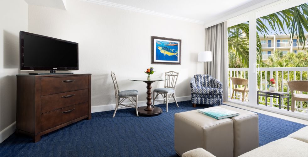 A Living Room With A Blue Rug