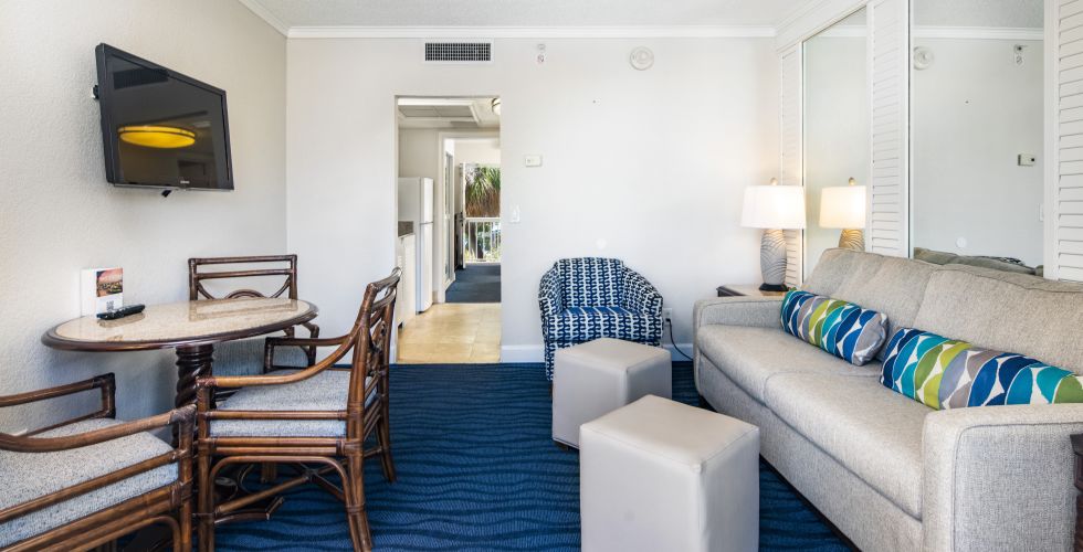 A Living Room With A Couch And A Tv