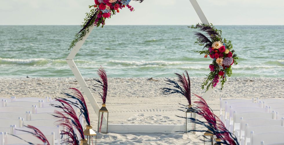 A Beach With Chairs And Tables