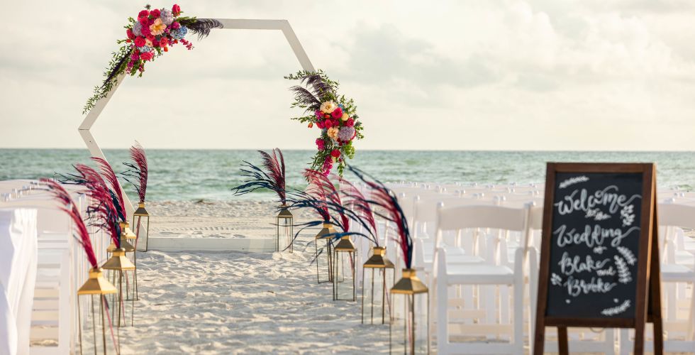 A Beach With Chairs And Tables