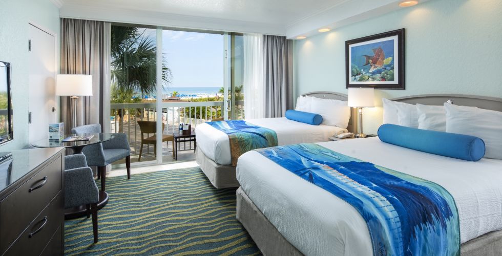 A Bedroom With A Large Bed In A Hotel Room