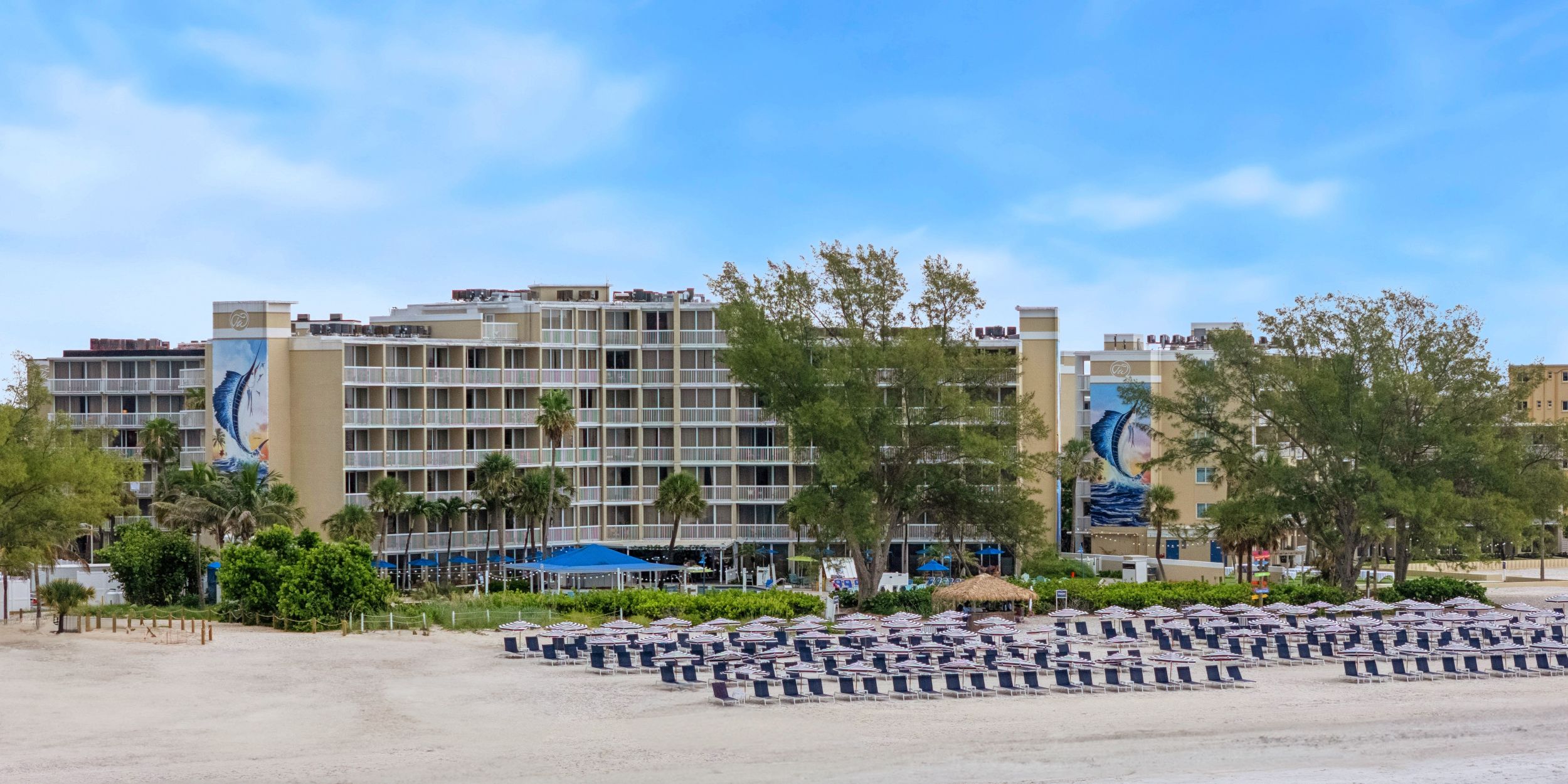 A Beach With Buildings And Trees