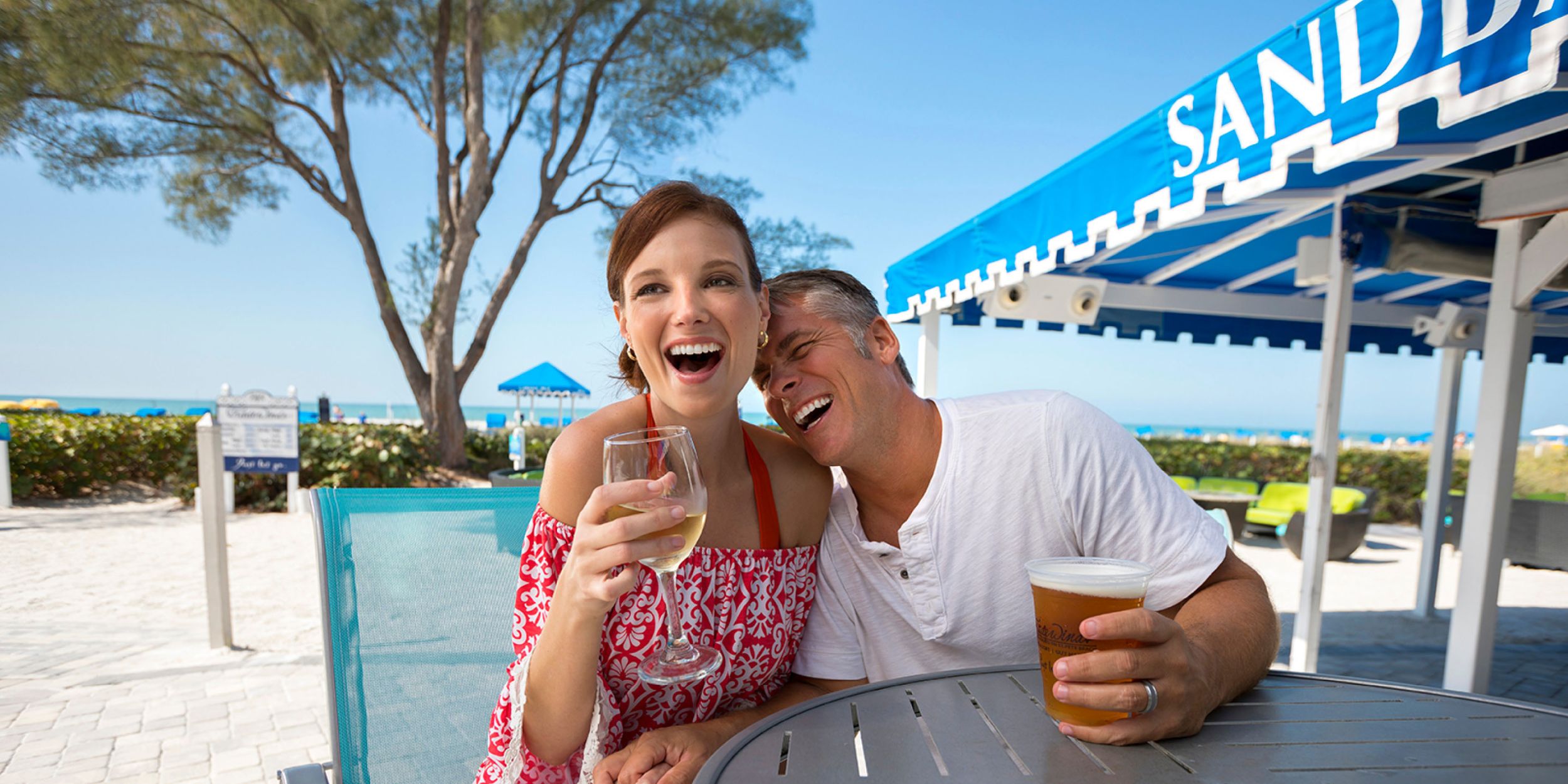 A Person Sitting At A Table Eating Food