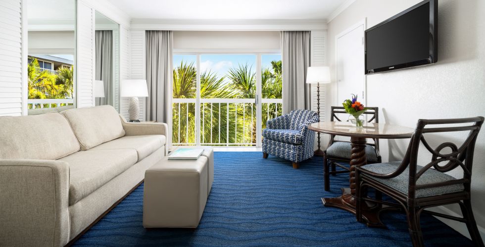 A Living Room With A Blue Carpet