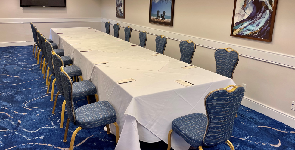 A Room With A Table And Chairs